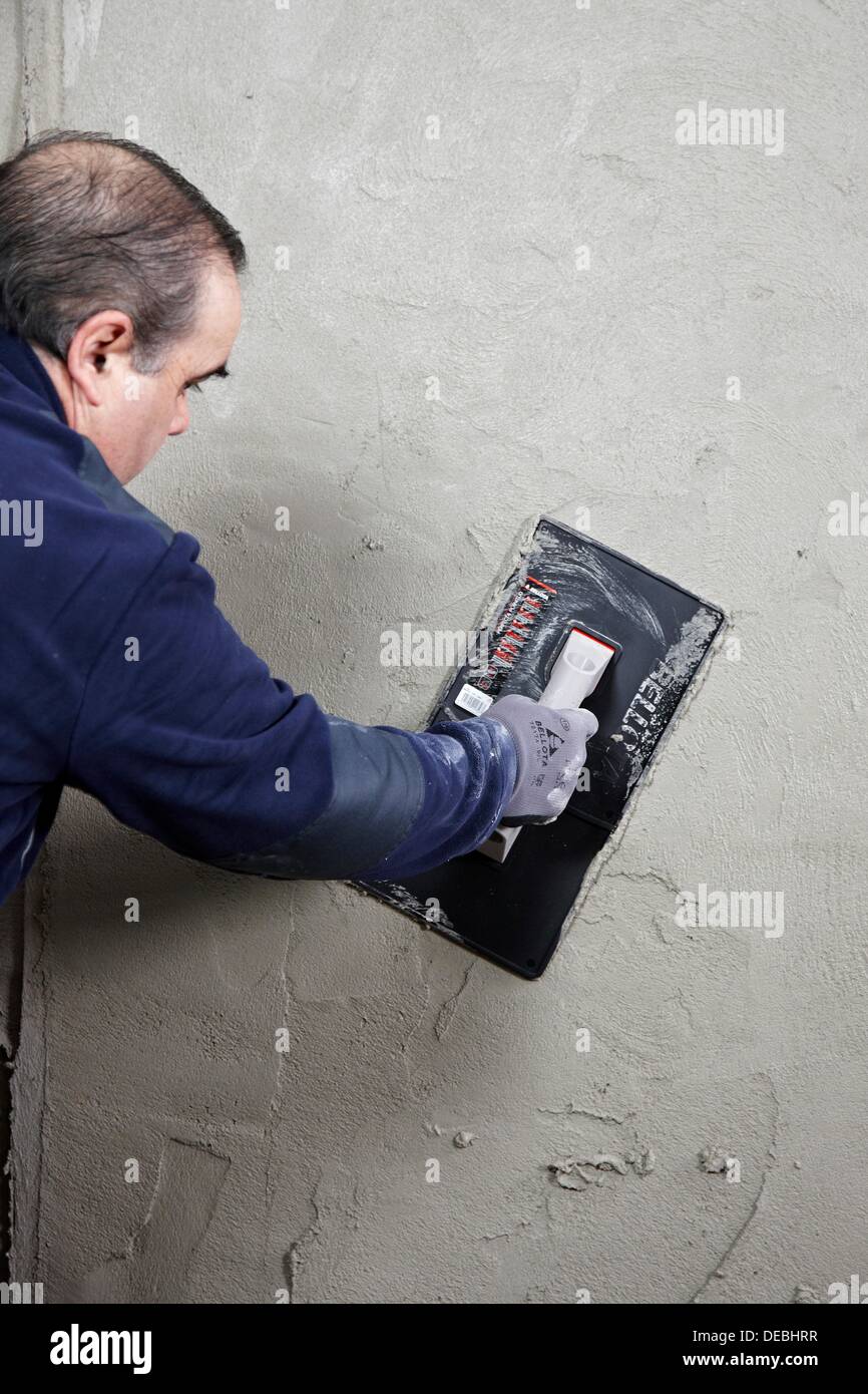 Roughcast, plastering trowel, new homes under construction