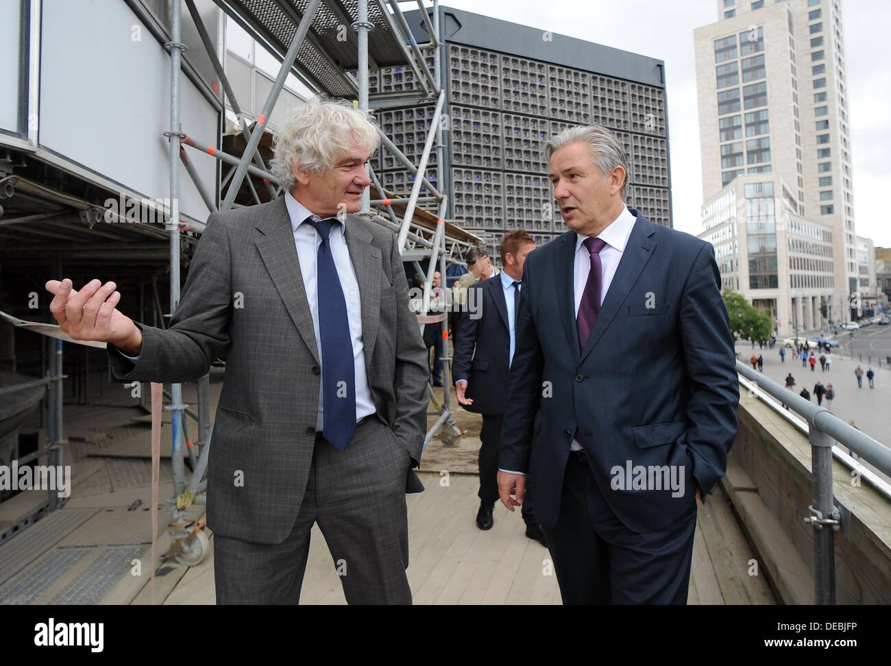 Berlin, Germany. 15th Sep, 2013. Architect Gerhard Schlotter (l) and Mayor of Berlin, Klaus Wowereit, inspect the progress of the construction works on the Kaiser Wilhelm Memorial Church after visiting a service in the church in Berlin, Germany, 15 September 2013. The church tower has been refurbished and the restored chime rang again at twelve noon. Photo: BRITTA PEDERSEN/dpa/Alamy Live News Stock Photo