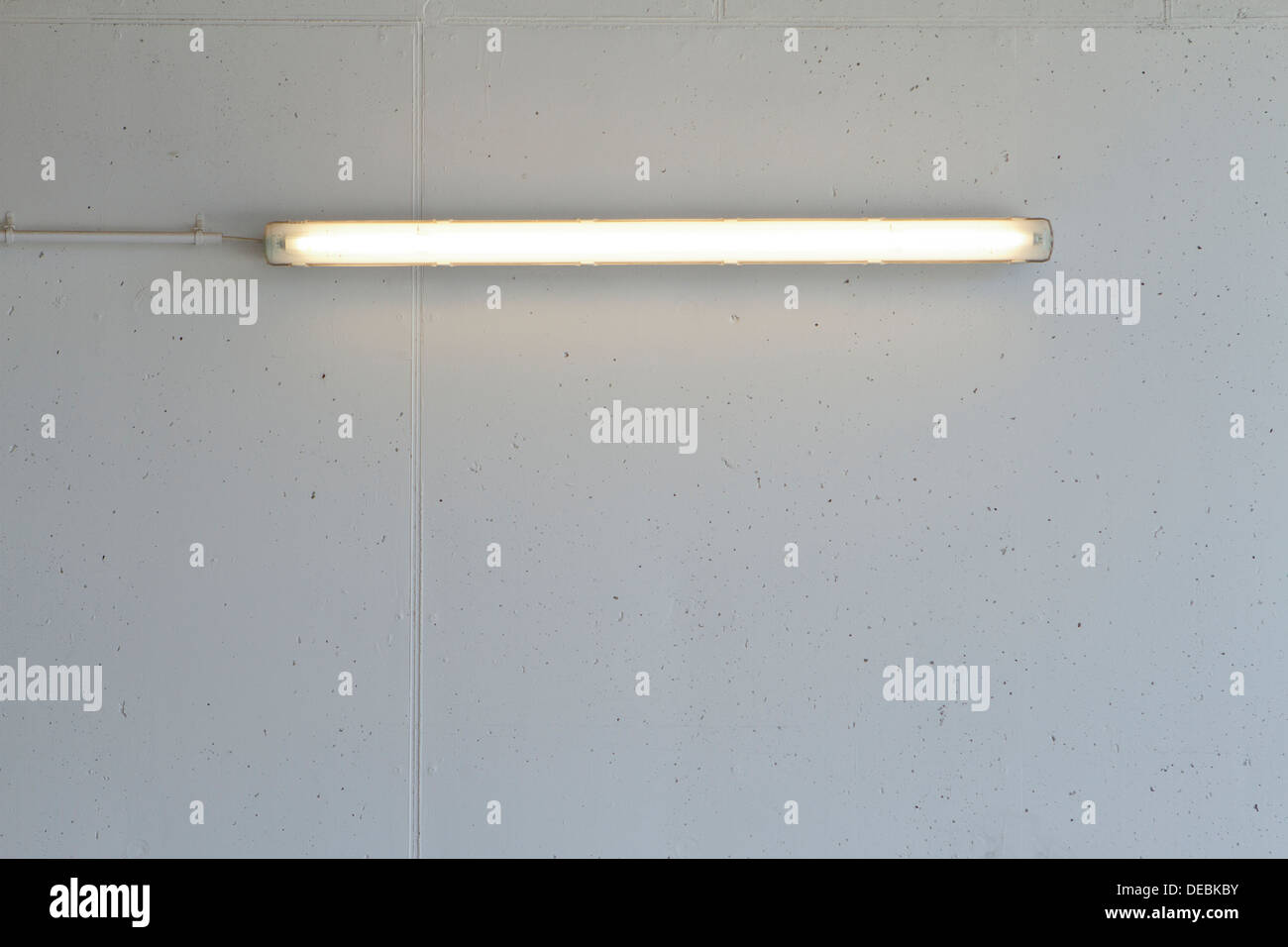 Fluorescent light on concrete wall Stock Photo Alamy