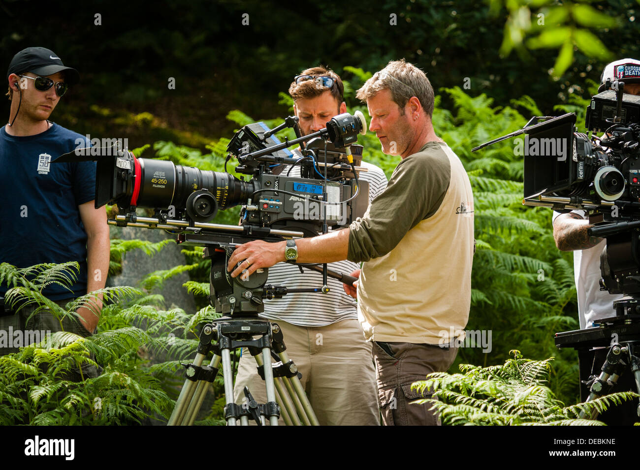 A camera crew on location filming using an Arri Alexa camera with a 45-250mm Alura zoom lens, UK Stock Photo