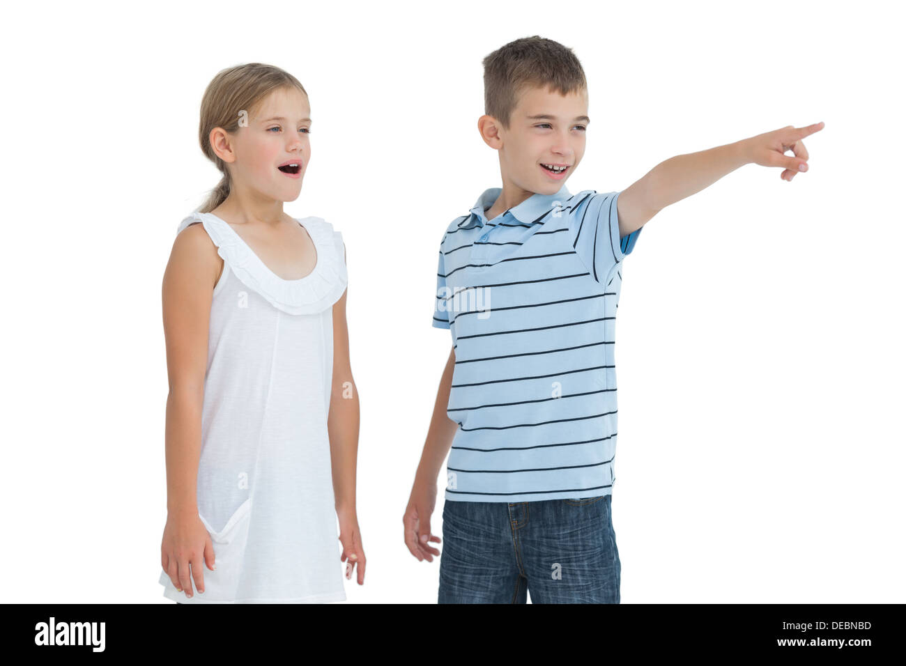 Young boy showing something to his sister Stock Photo