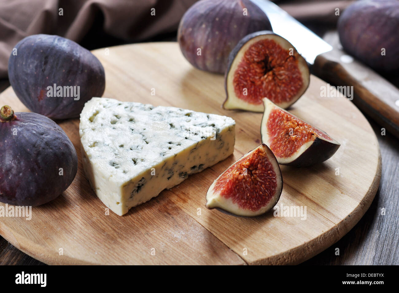 blue cheese and fresh figs fruit on a wooden cutting board Stock Photo