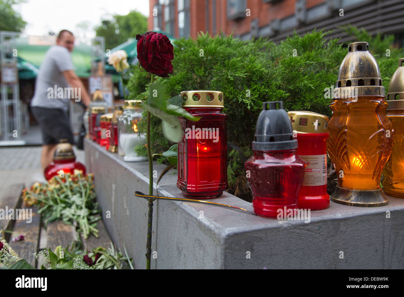 Poznan, Poland, funeral candles and rose at the scene of a murder in the pedestrian Polwiejska Stock Photo
