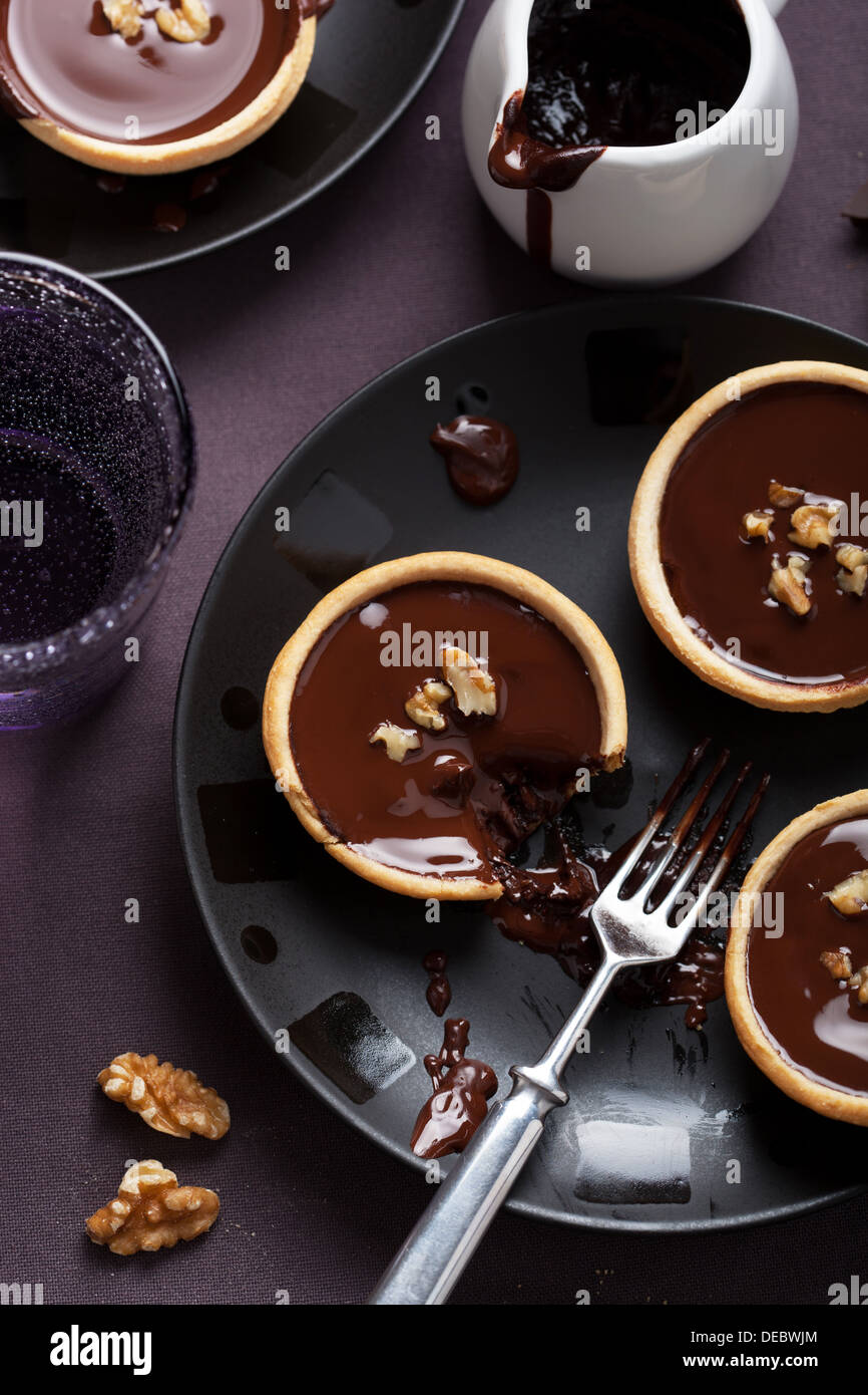 tartelettes with chocolate ganache and walnuts Stock Photo
