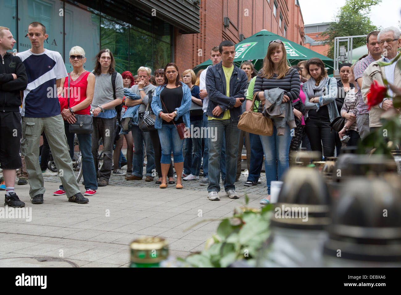 Poznan, Poland, silent tribute at the end of a funeral march at the scene of a murder in the pedestrian Stock Photo