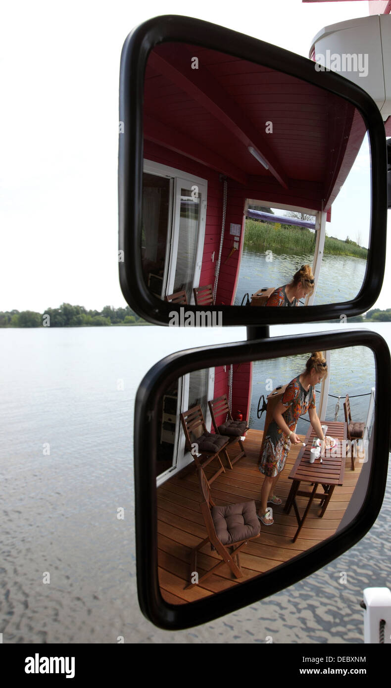 Brandenburg, Germany, a woman on a boat on the river Havel Bungalow Stock Photo