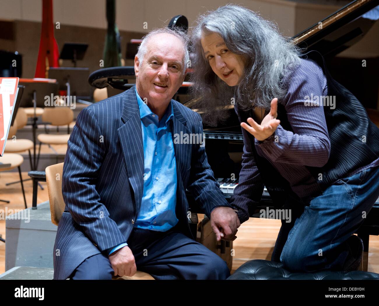 Berlin, Germany. 14th Sep, 2013. Director Daniel Barenboim and the Argetinian piano player, Martha Argerich, talk to each other after a rehearsal in the philharmonic hall of Berlin, Germany, 14 September 2013. Photo: SOEREN STACHE/dpa/Alamy Live News Stock Photo