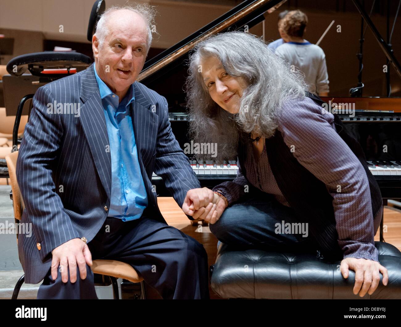 Berlin, Germany. 14th Sep, 2013. Director Daniel Barenboim and the Argetinian piano player, Martha Argerich, talk to each other after a rehearsal in the philharmonic hall of Berlin, Germany, 14 September 2013. Photo: SOEREN STACHE/dpa/Alamy Live News Stock Photo