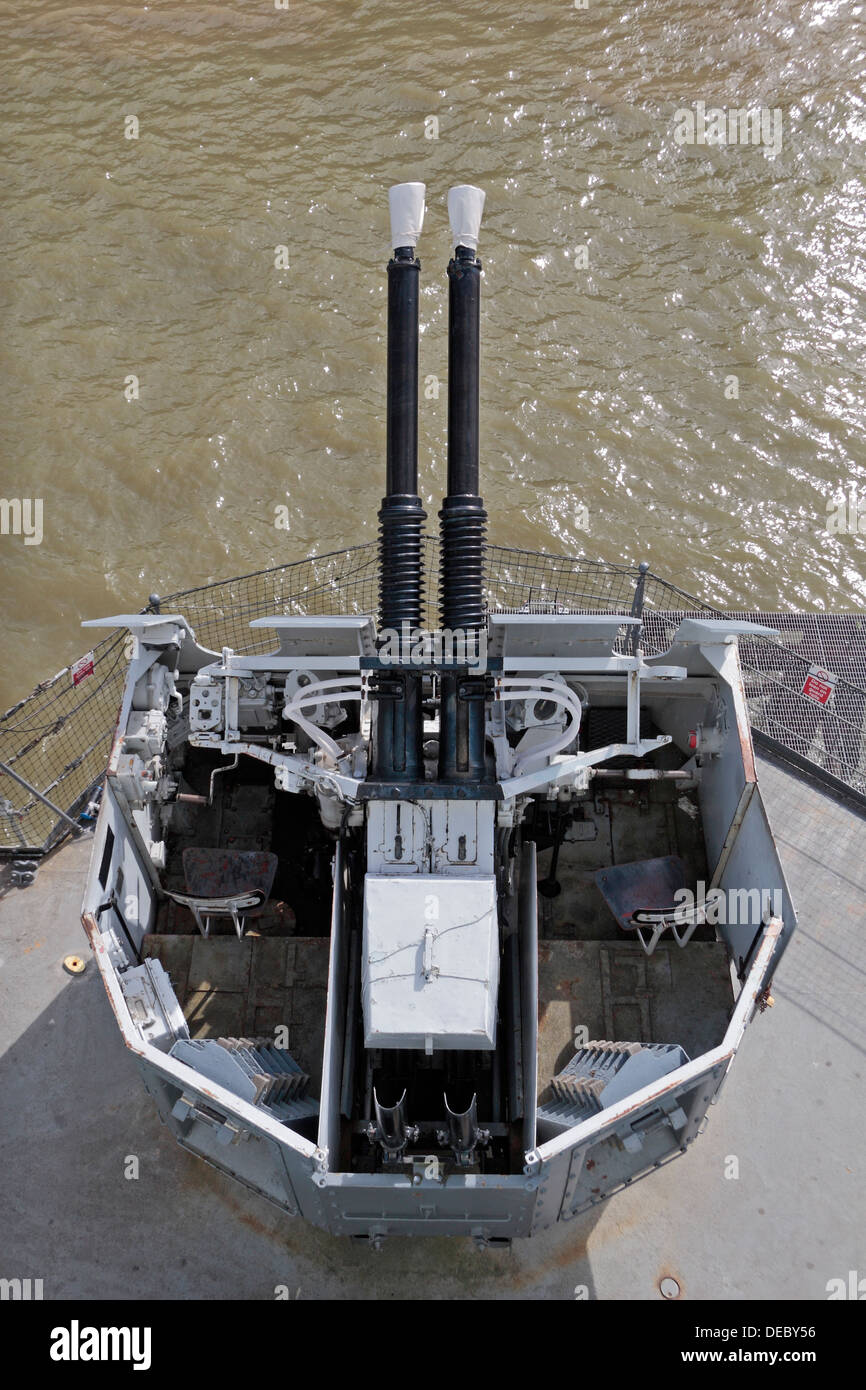 40mm Bofors anti-aircraft guns on HMS Belfast, a Royal Navy light cruiser, moored on the River Thames, London, UK. Stock Photo