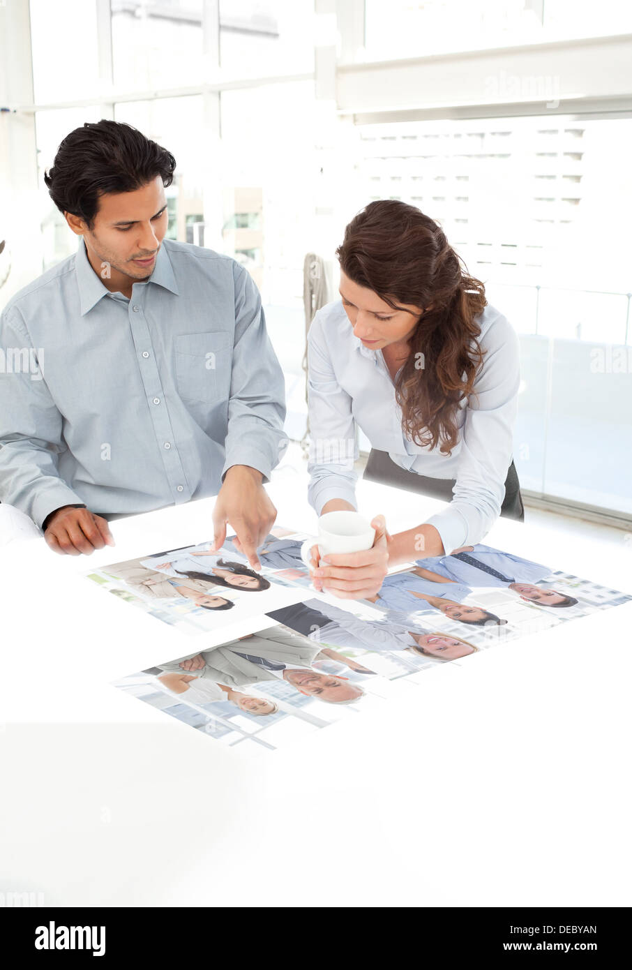 Young colleagues working together using digital interface Stock Photo