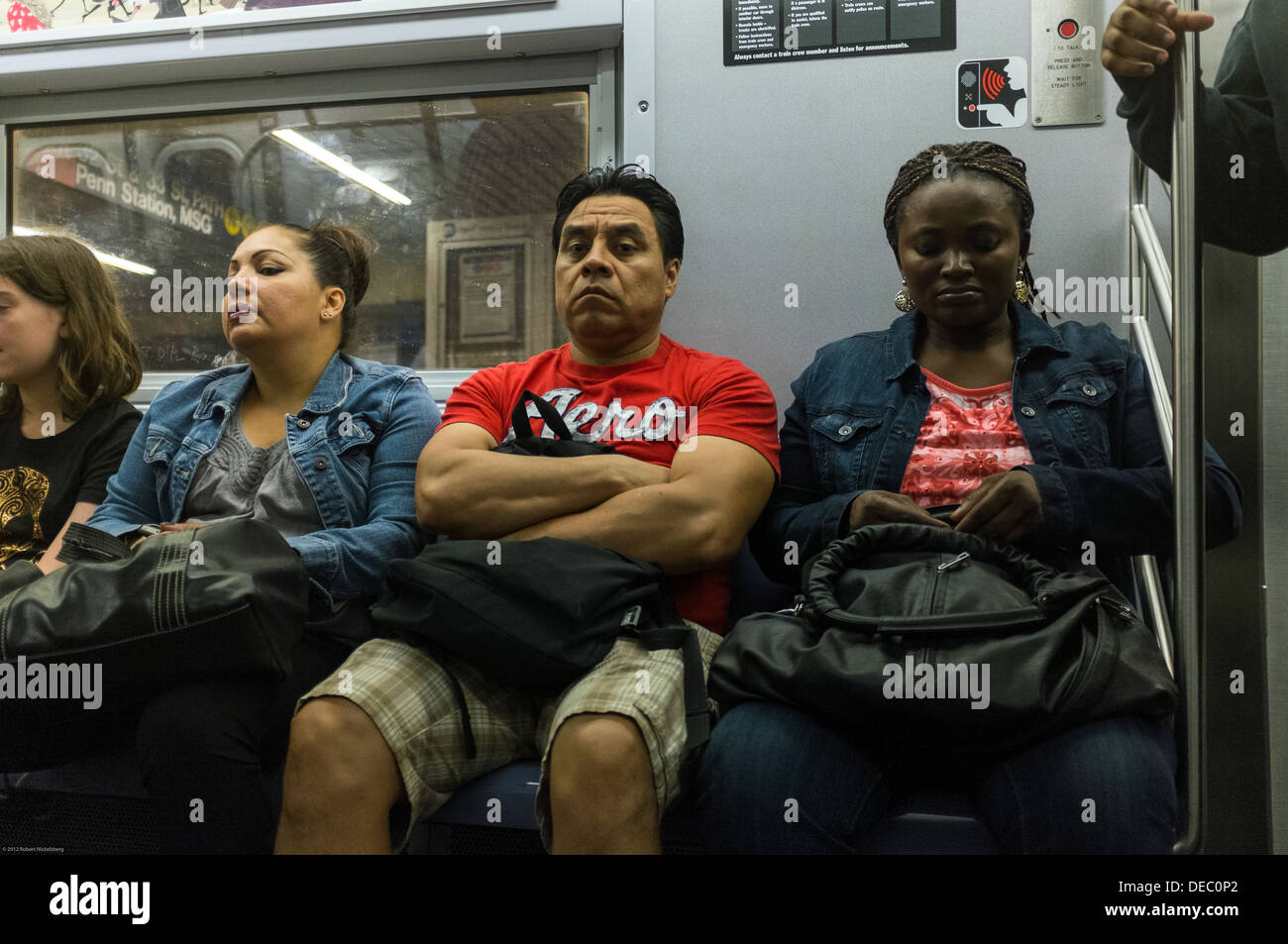 Passengers sit on a New York City subway car Stock Photo - Alamy