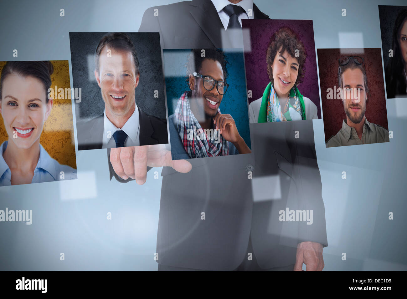 Businessman presenting profile pictures Stock Photo