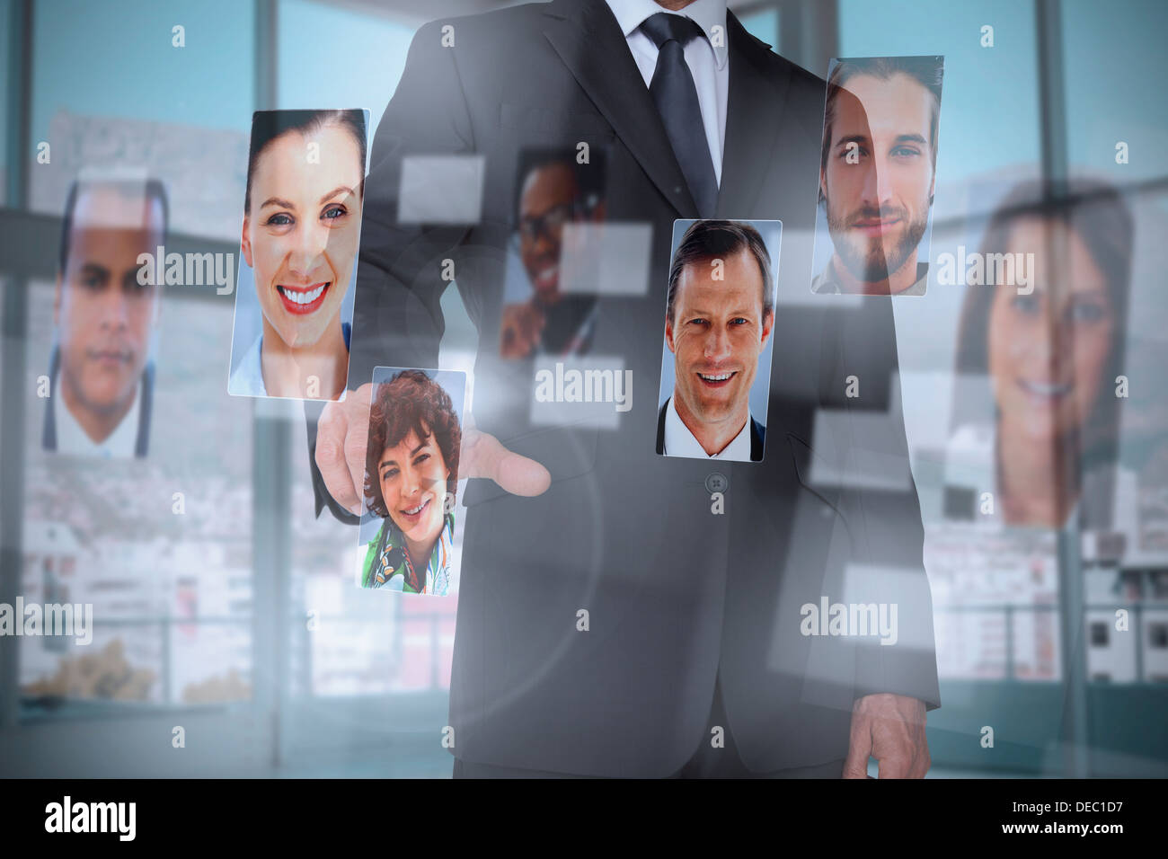 Classy businessman presenting profile pictures Stock Photo
