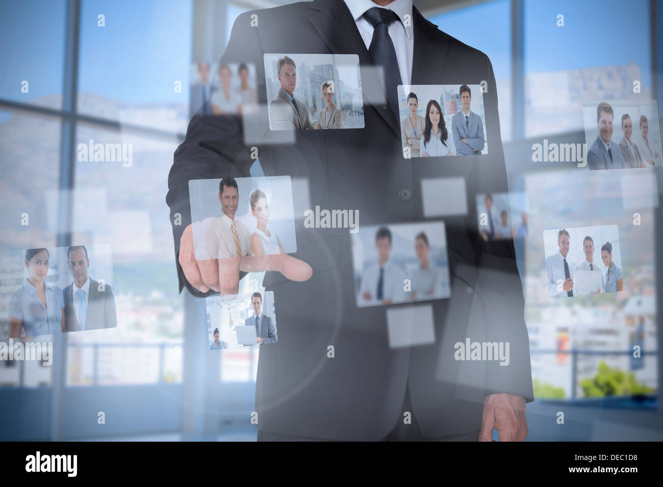 Stylish businessman presenting coworkers pictures Stock Photo