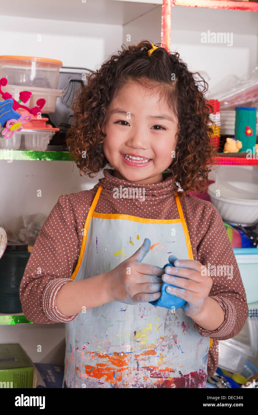 Girl wearing apron playing hi-res stock photography and images - Alamy
