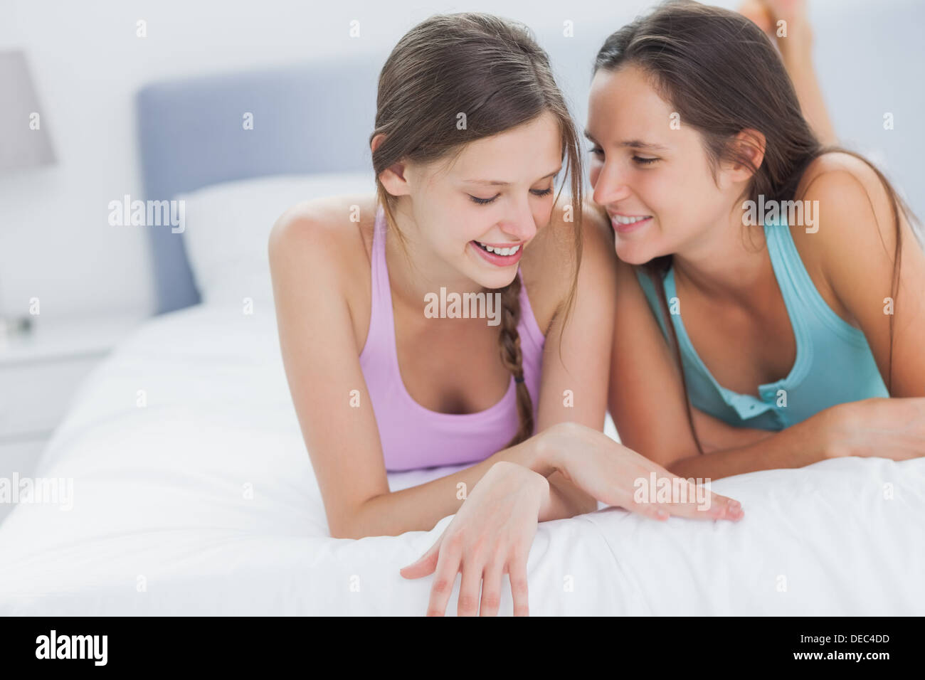 Girls gossiping at girls night in Stock Photo