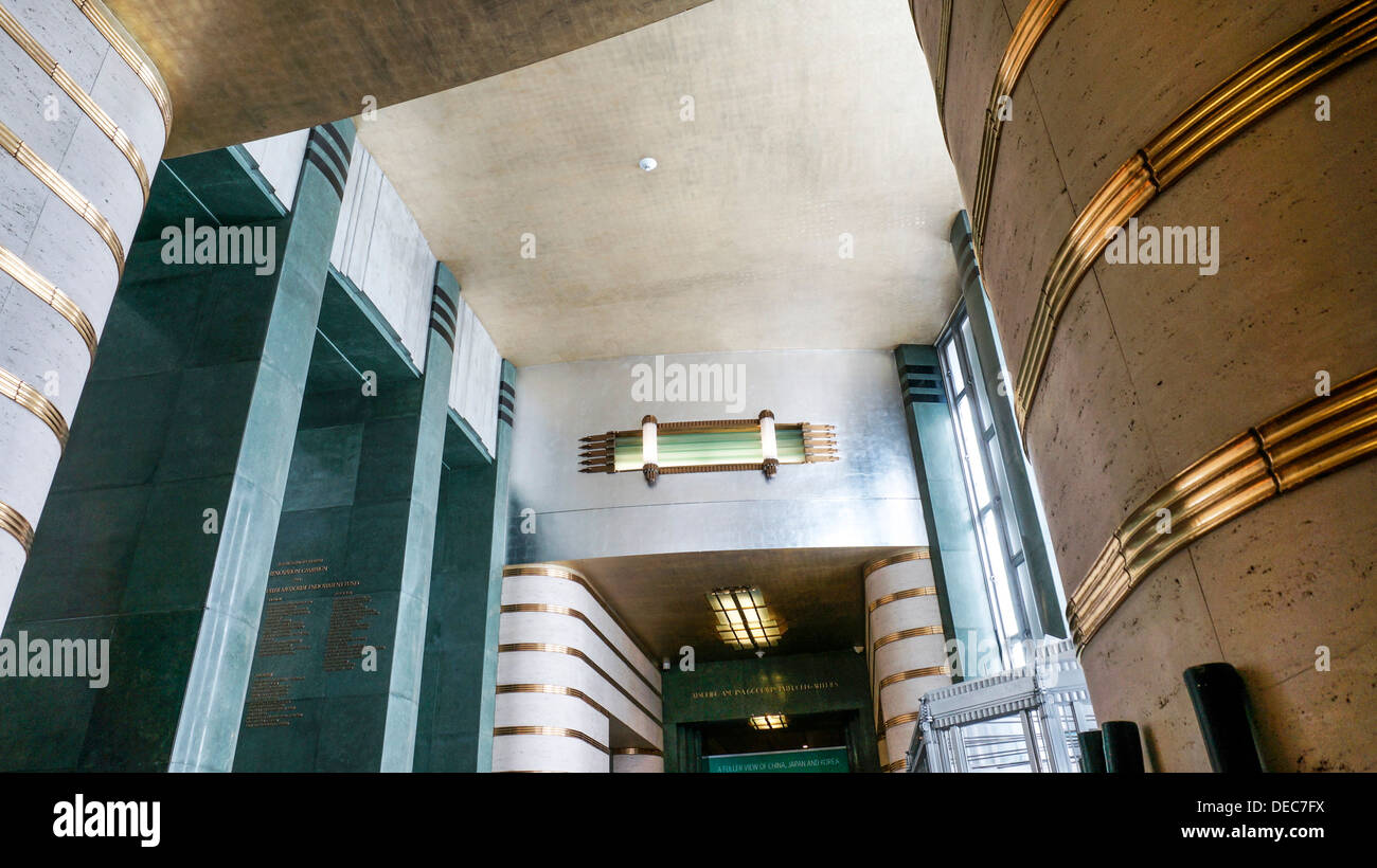 elegant wall & ceiling sufaces sumptuous bronze & stainless steel decorative elements in 2 story entrance hall Art Deco Museum Stock Photo