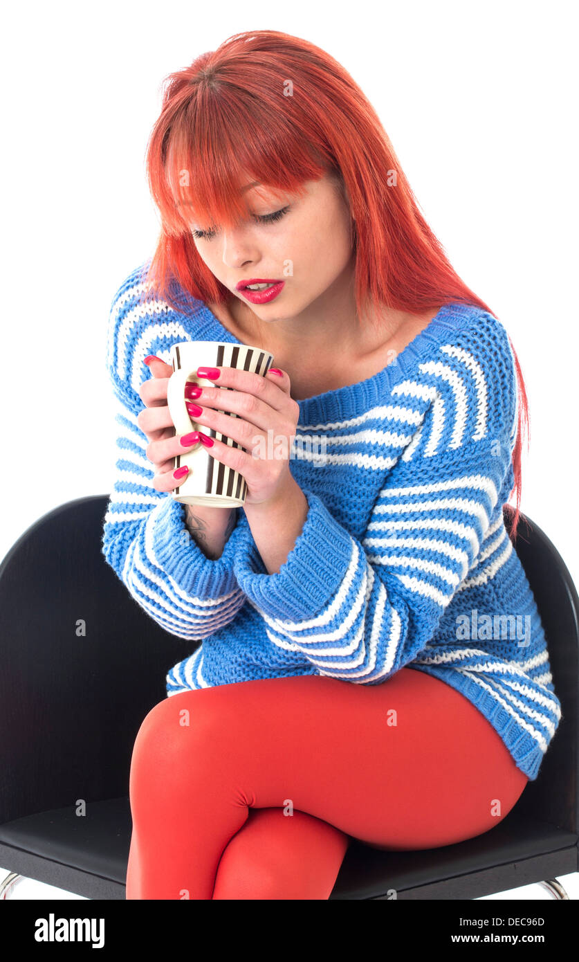 Model Released. Attractive Young Woman Drinking Coffee Stock Photo