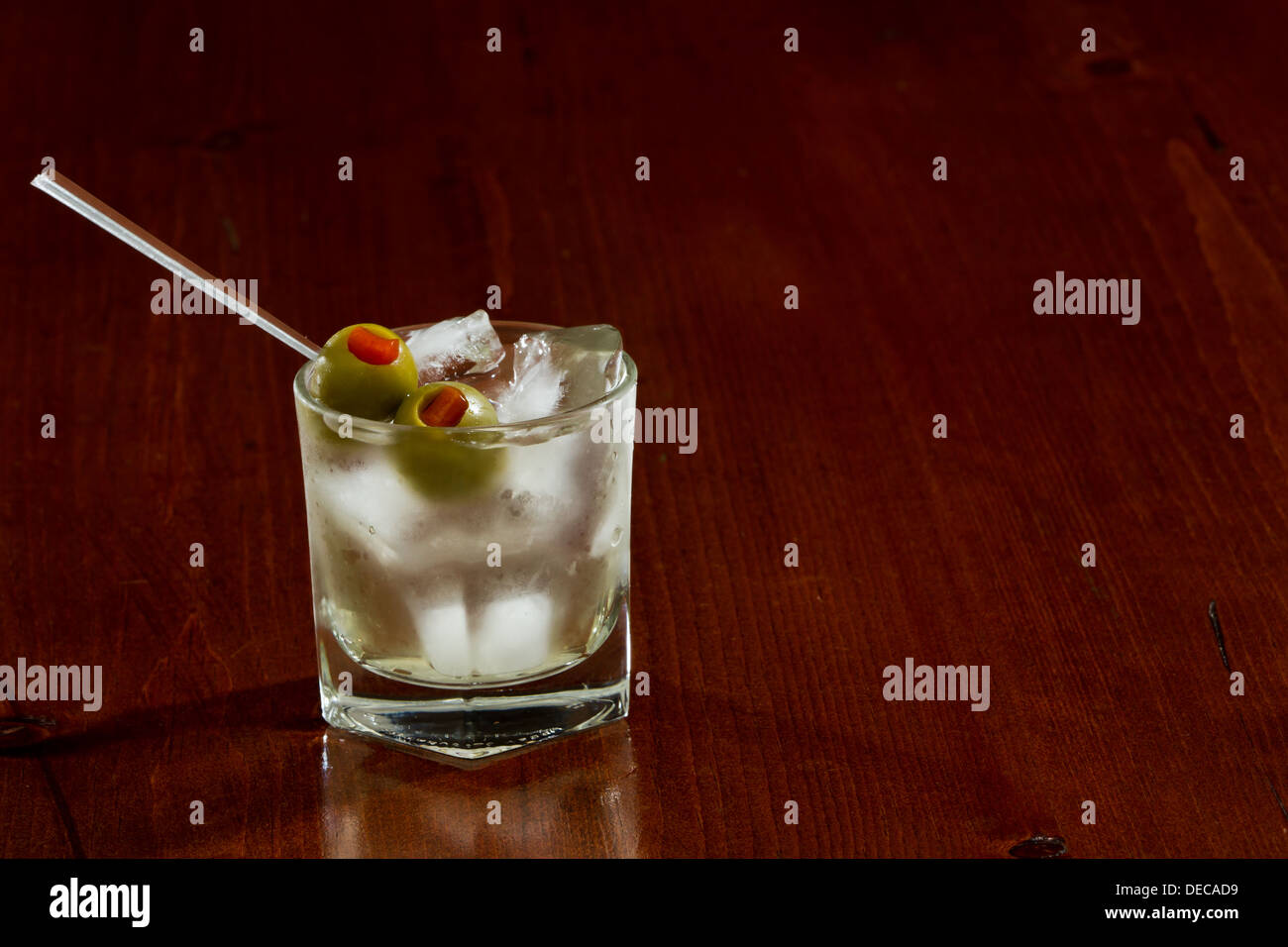 classic cocktail served on the rocks with pimento stuffed cocktail