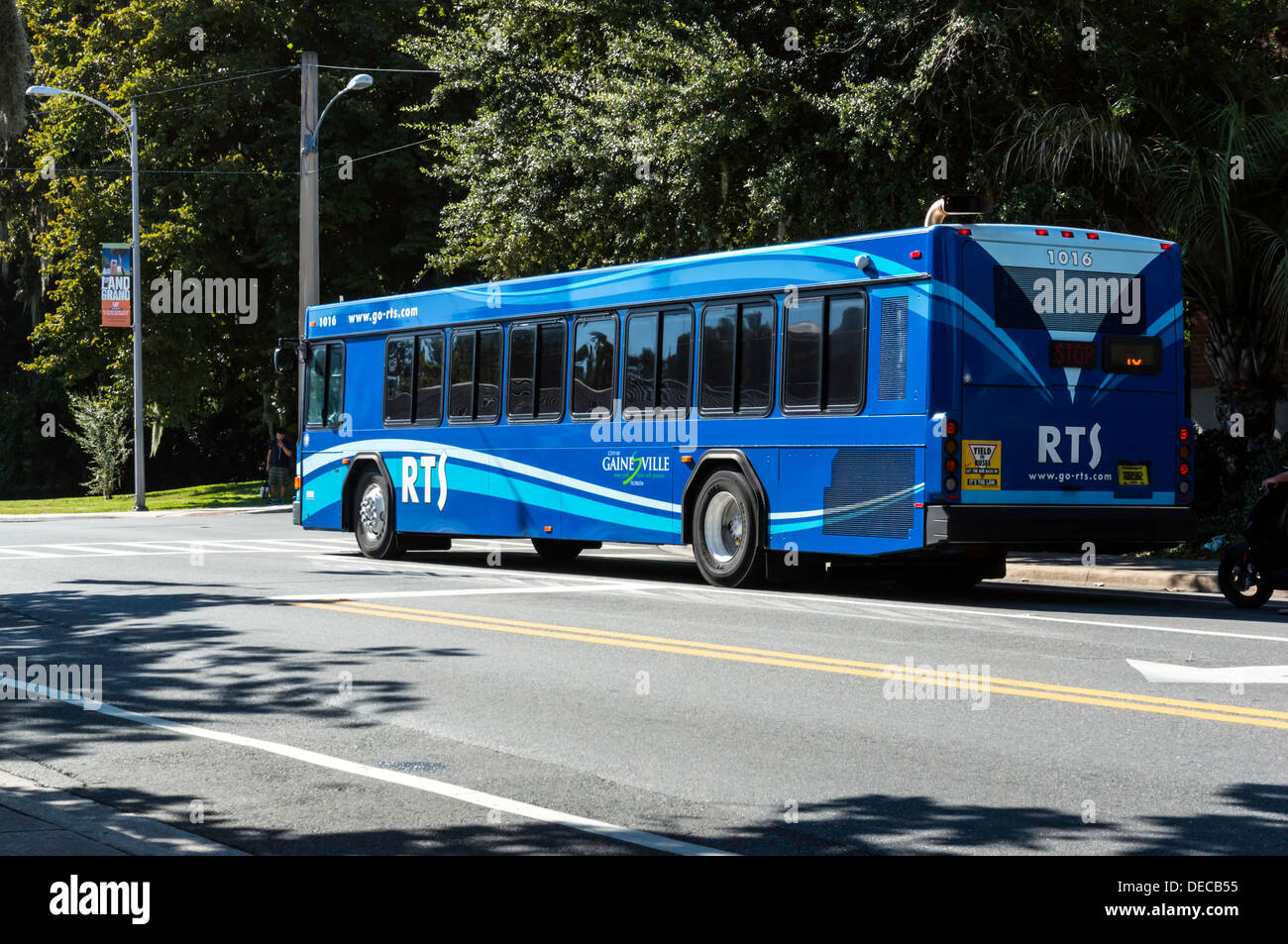 Blue Gainesville RTS commuter passenger bus on city street. Stock Photo