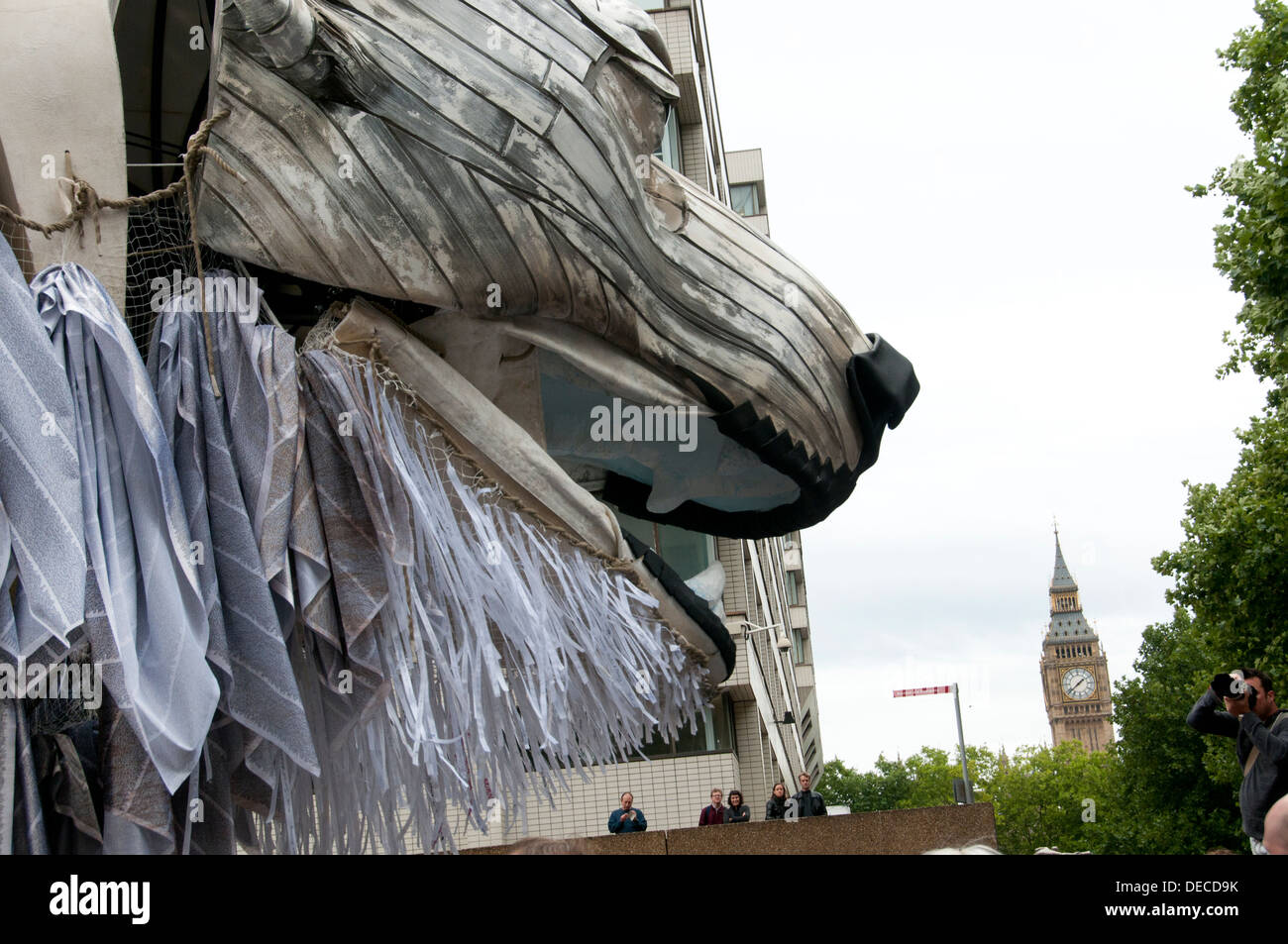 Aurora, the polar bear puppet commissioned by Greenpeace to lead an Arctic-inspired street parade with Big Ben behind Stock Photo