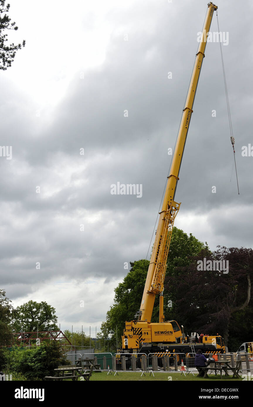 Yellow crane fully extended at Dunham Massey by the car park picnic