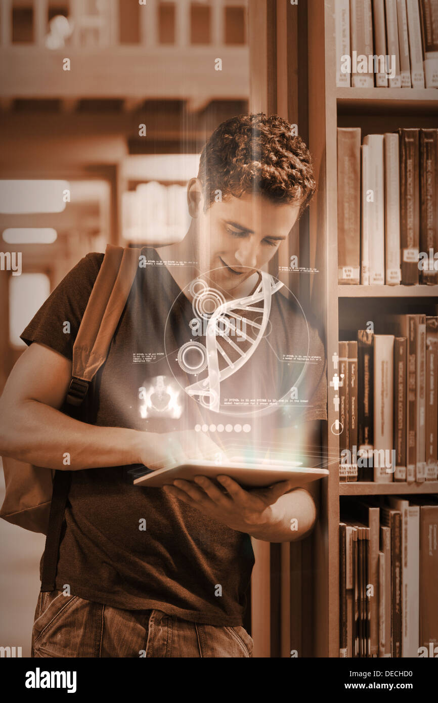Focused student working on his futuristic tablet Stock Photo