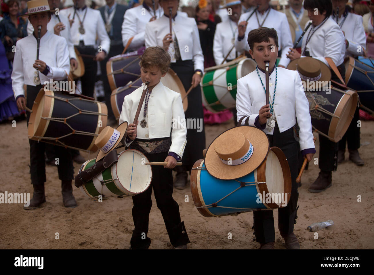Two young drummers of tamborileros play the flute in a band during the pilgrimage to the shrine