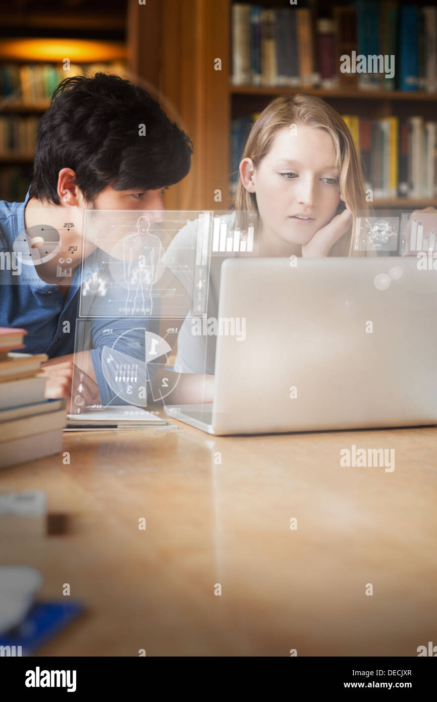 Focused students working on new technologies Stock Photo