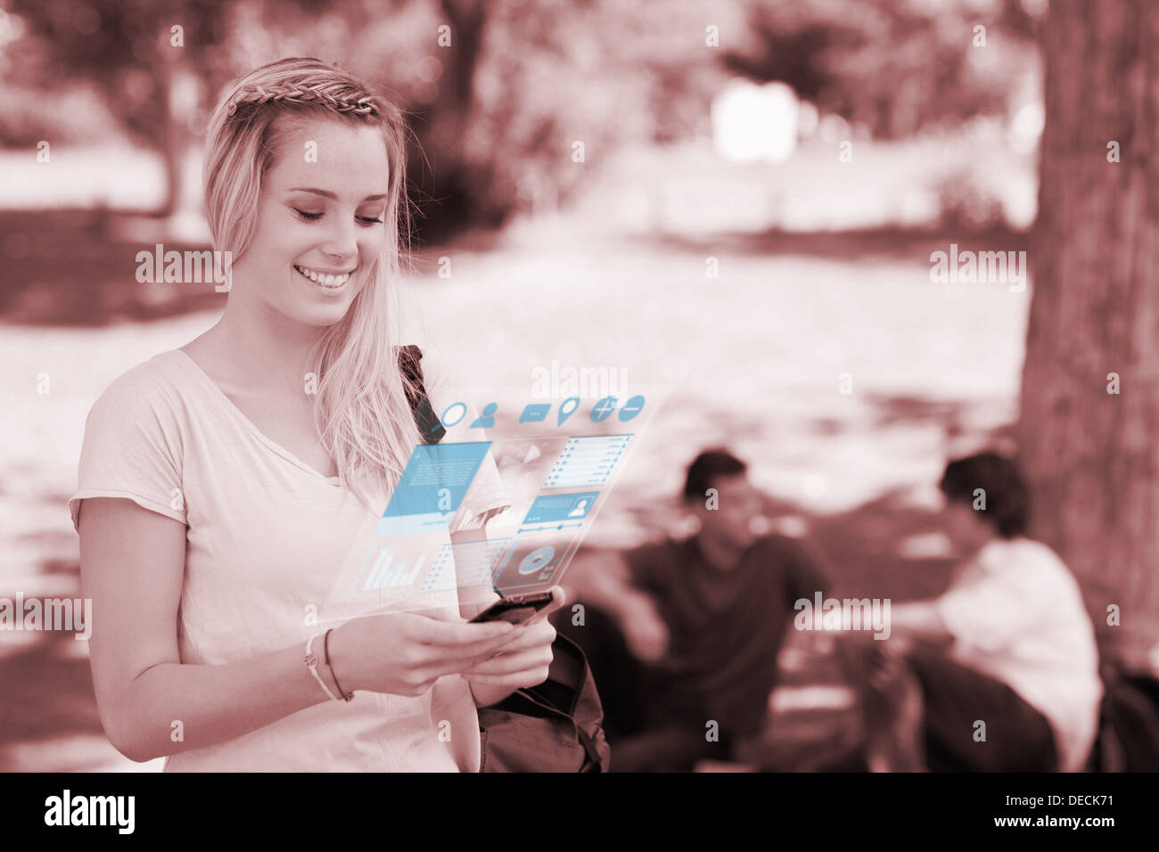 Cheerful pretty blonde working on her digital smartphone Stock Photo