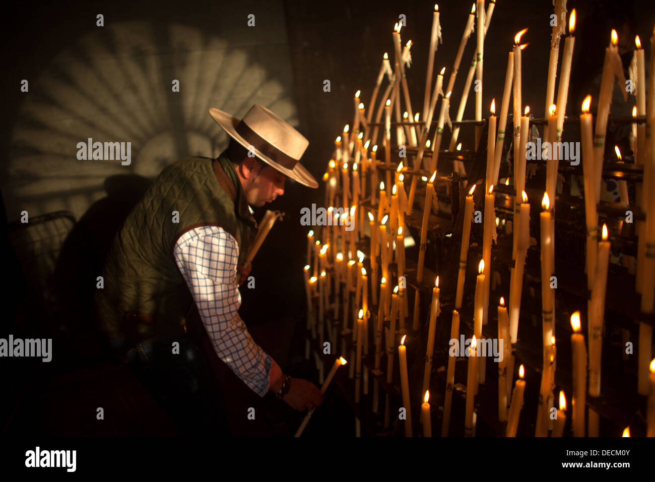 Spanish Ritual Candles Man lighting votive candles hi-res stock photography and images - Alamy