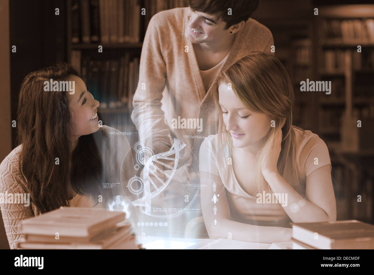 Cheerful students working together with futuristic interface Stock Photo