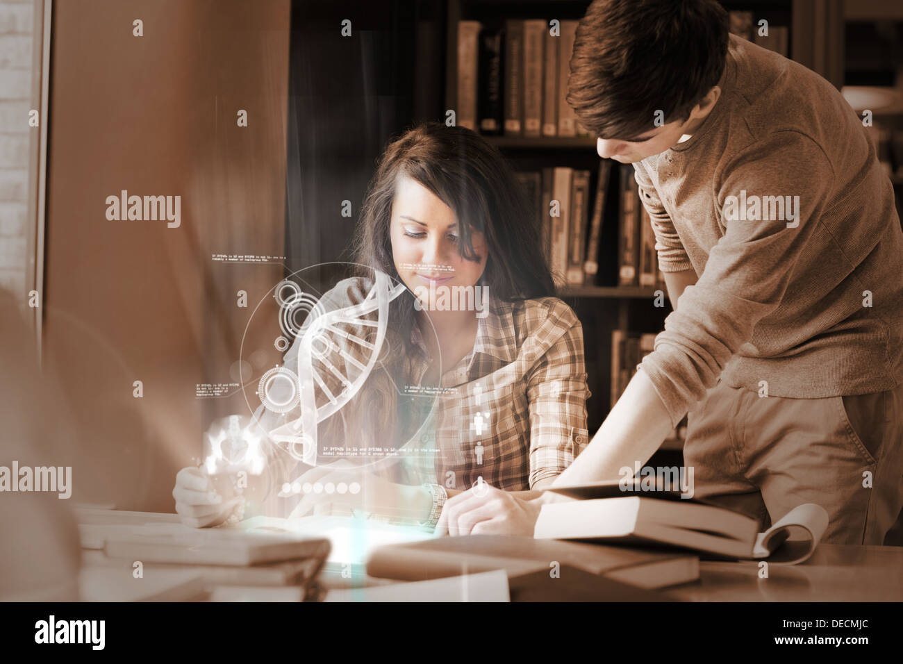 Focused college students analysing dna on digital interface Stock Photo
