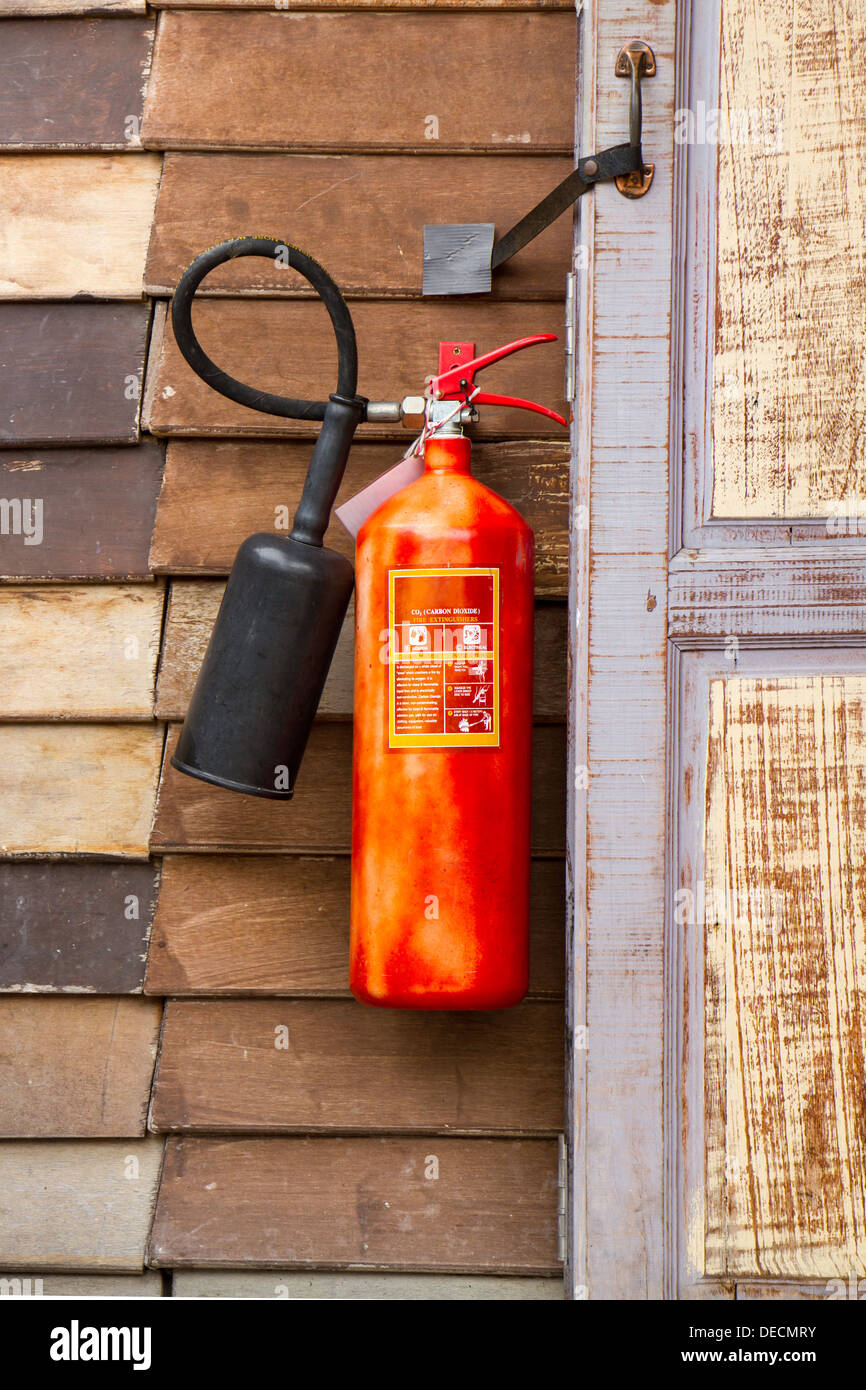 Old Fire extinguisher on wooden wall Stock Photo - Alamy