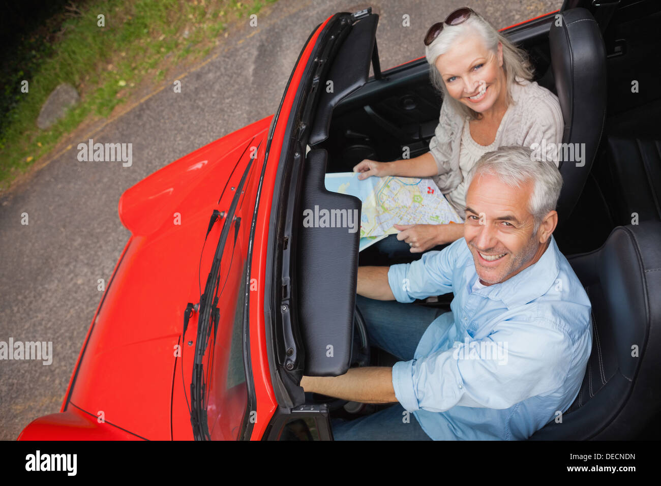 High angle view of smiling mature man having a ride with his wife Stock ...
