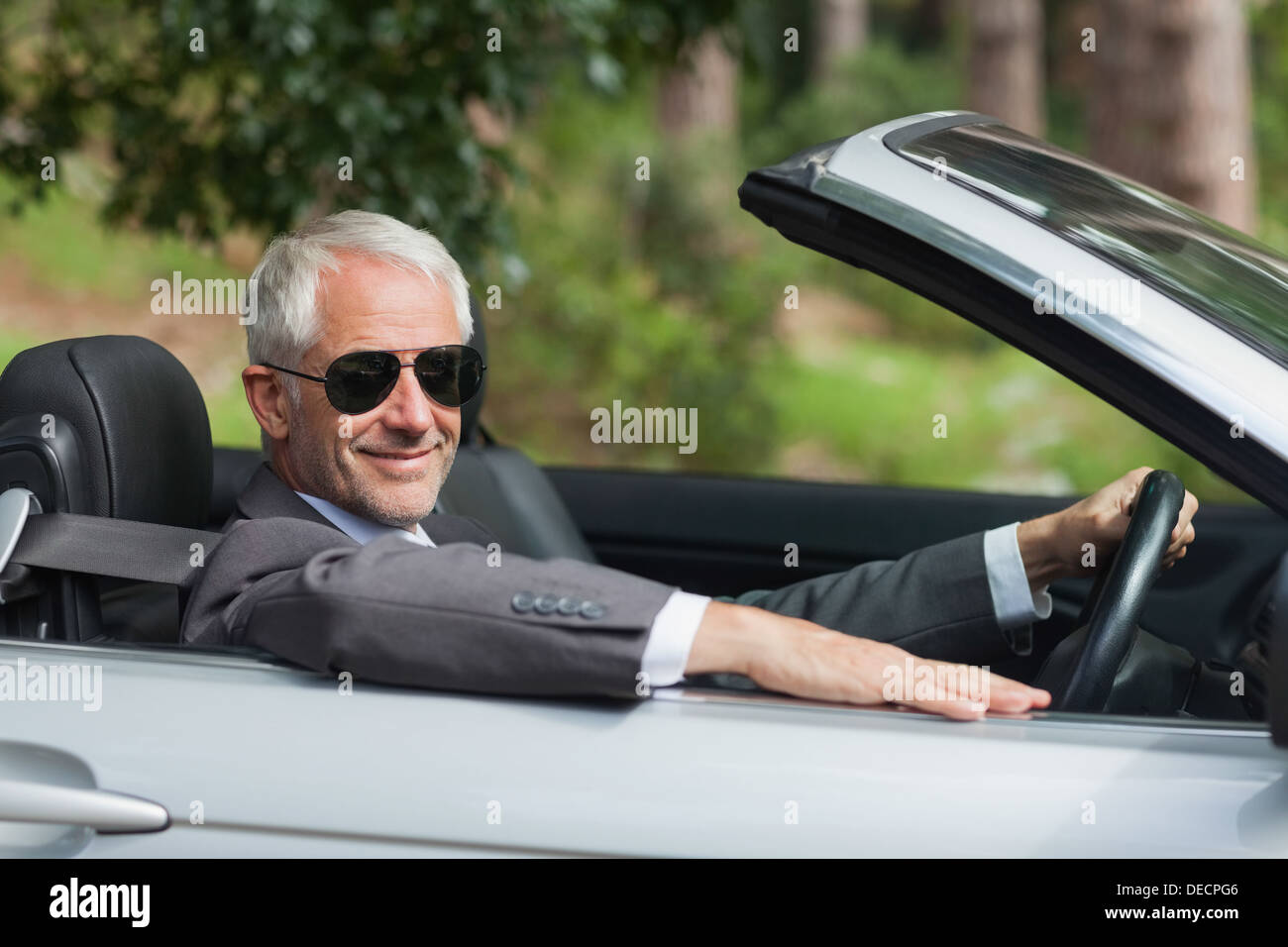 Smiling mature businessman hi-res stock photography and images - Alamy