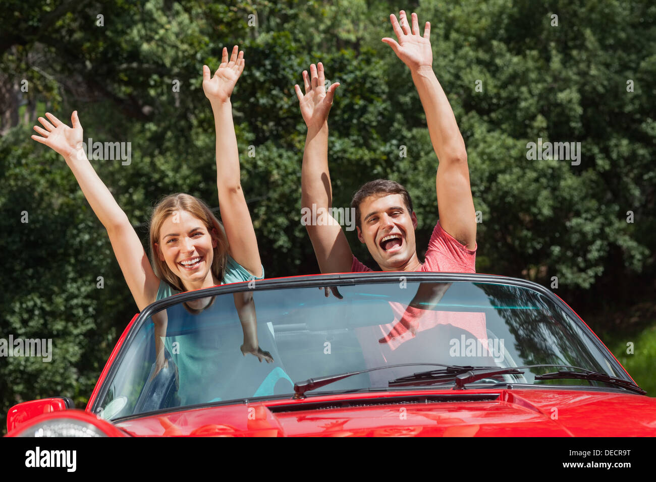 Happy couple having fun in their cabriolet Stock Photo