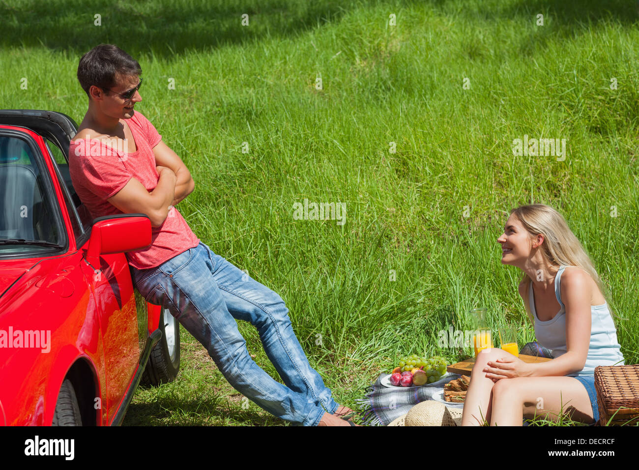 Smiling couple having picnic together Stock Photo