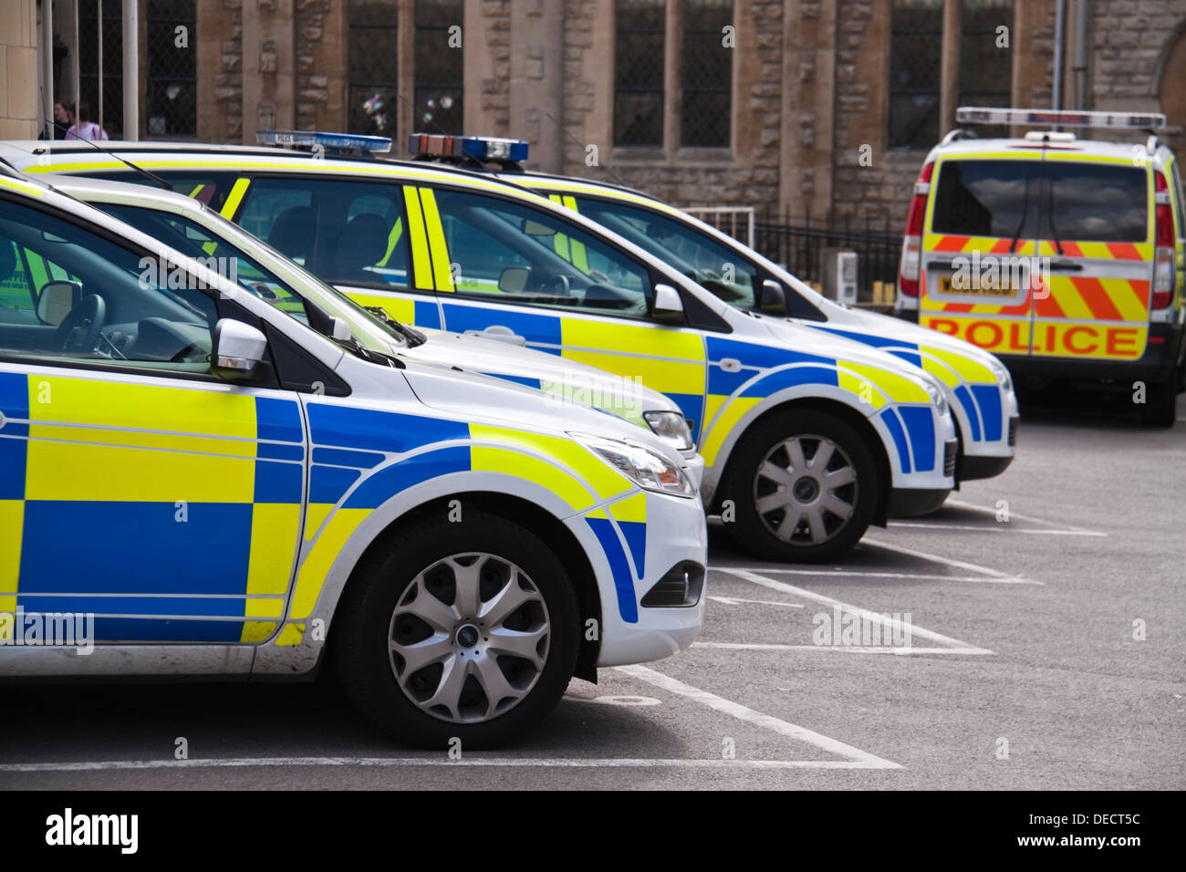 Row of police cars parked outside police station in Bath, UK Stock Photo