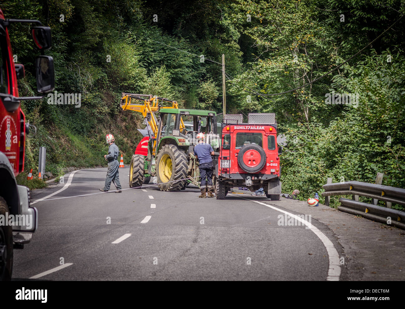Fire service and farmer's tractor retrieve car that went over cliff edge Stock Photo