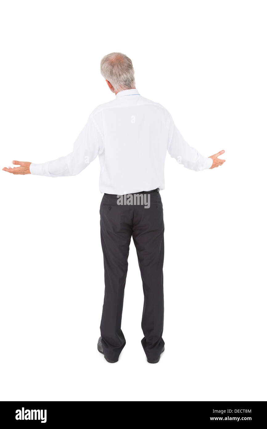 Rear view of surprised mature businessman posing Stock Photo