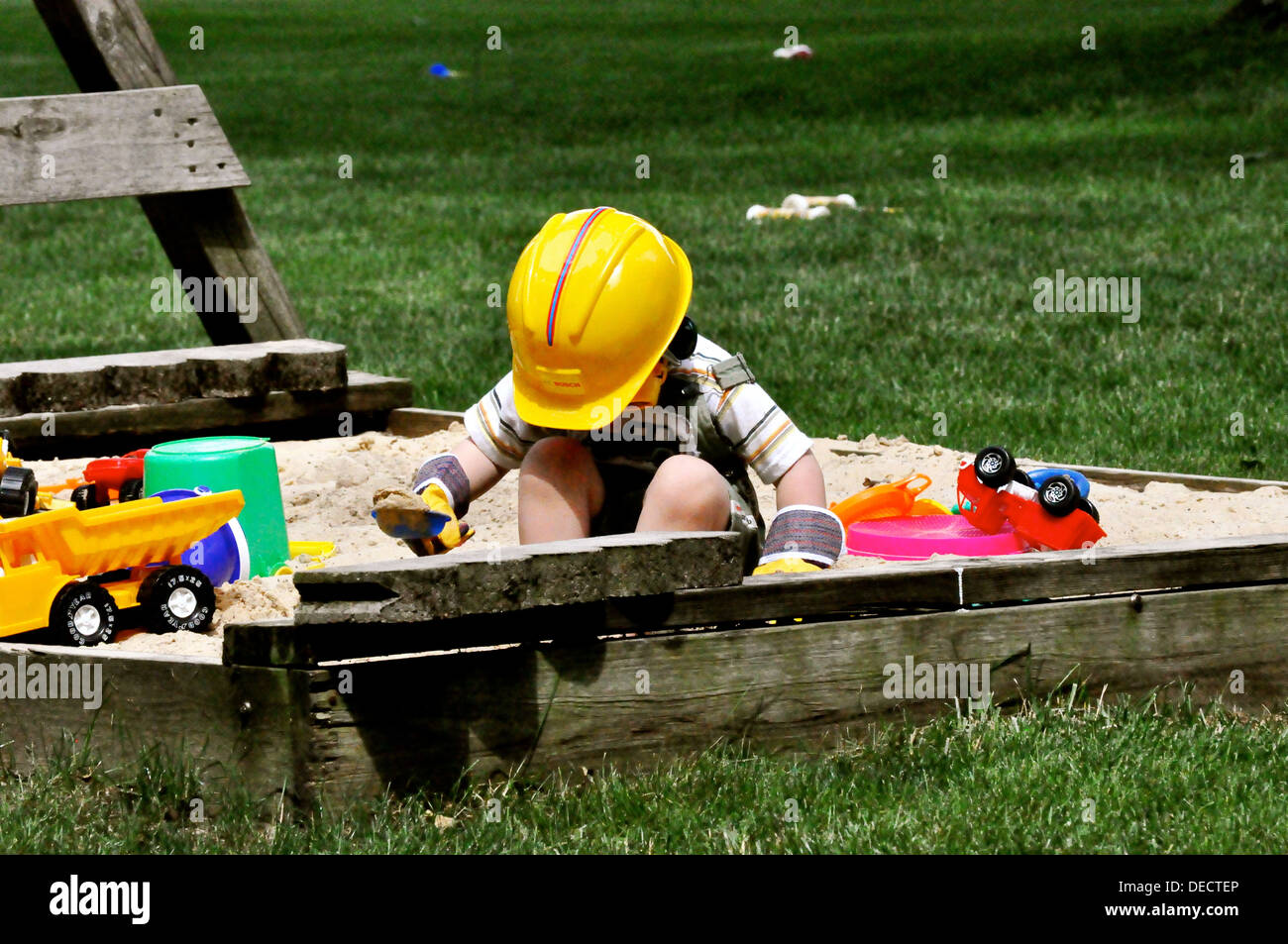 Boy plaing in sand Stock Photo