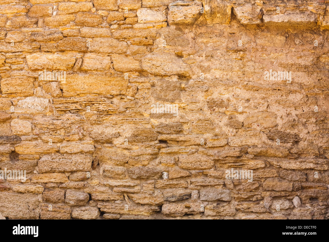 Old wall made of the Jerusalem stone. Wall constructed of stone bricks