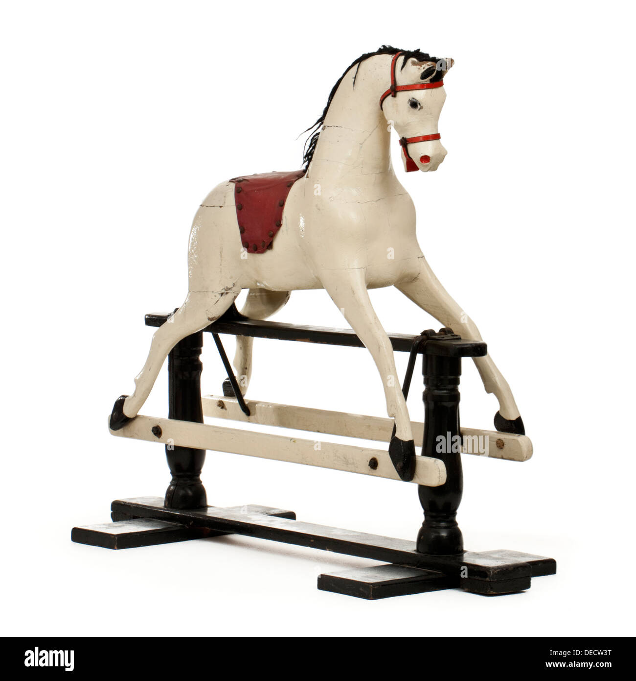 Vintage rocking horse on wooden frame Stock Photo