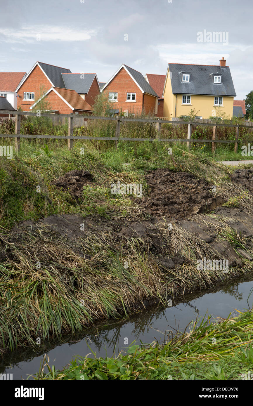 A newlycleared flood drainage drainage ditch near a housing estate in Suffolk, England Stock