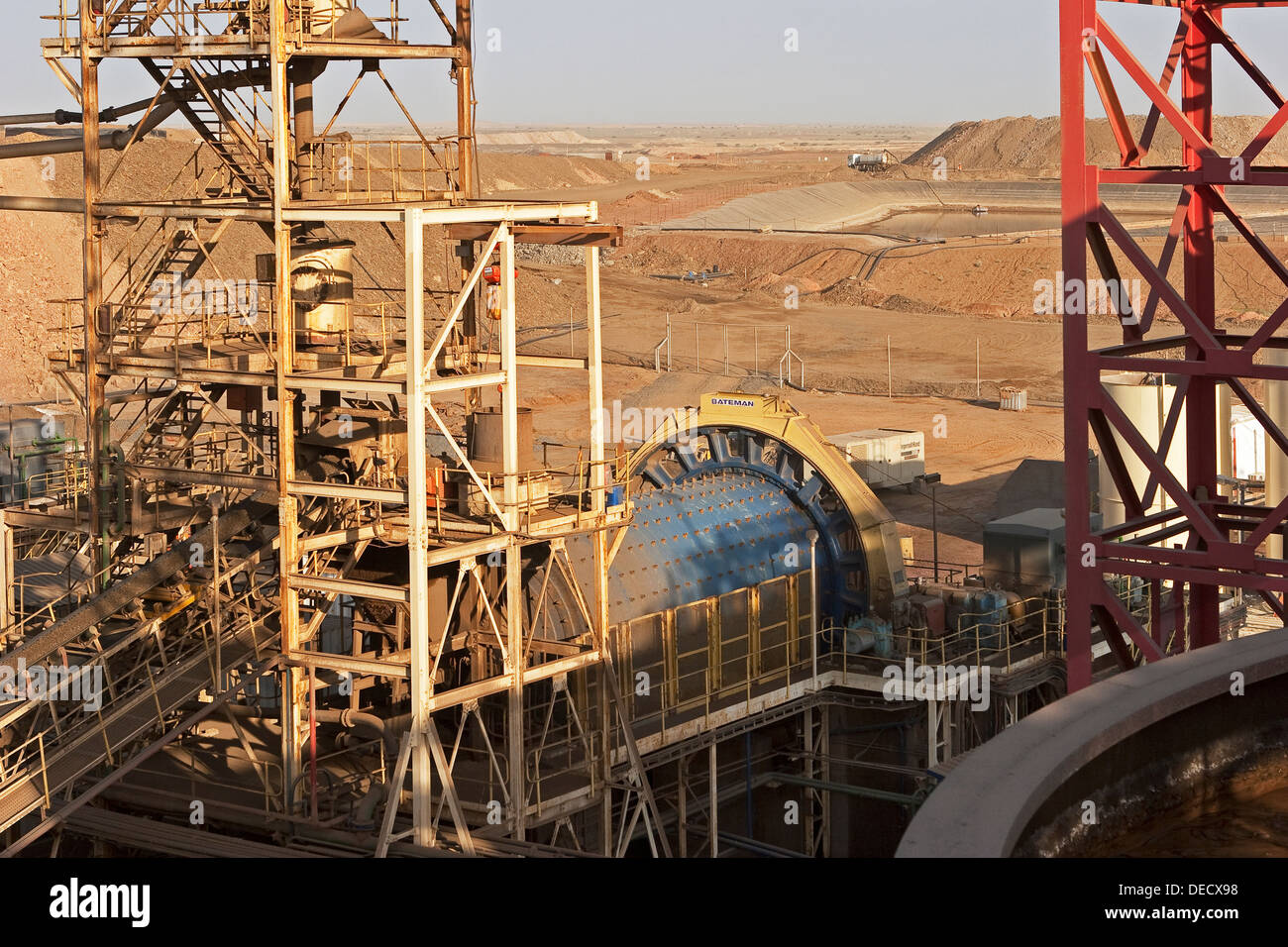 From carbon in leach plant to ball mill and water ponds, on open pit surface gold mine processing plant, Mauritania, NW Africa Stock Photo