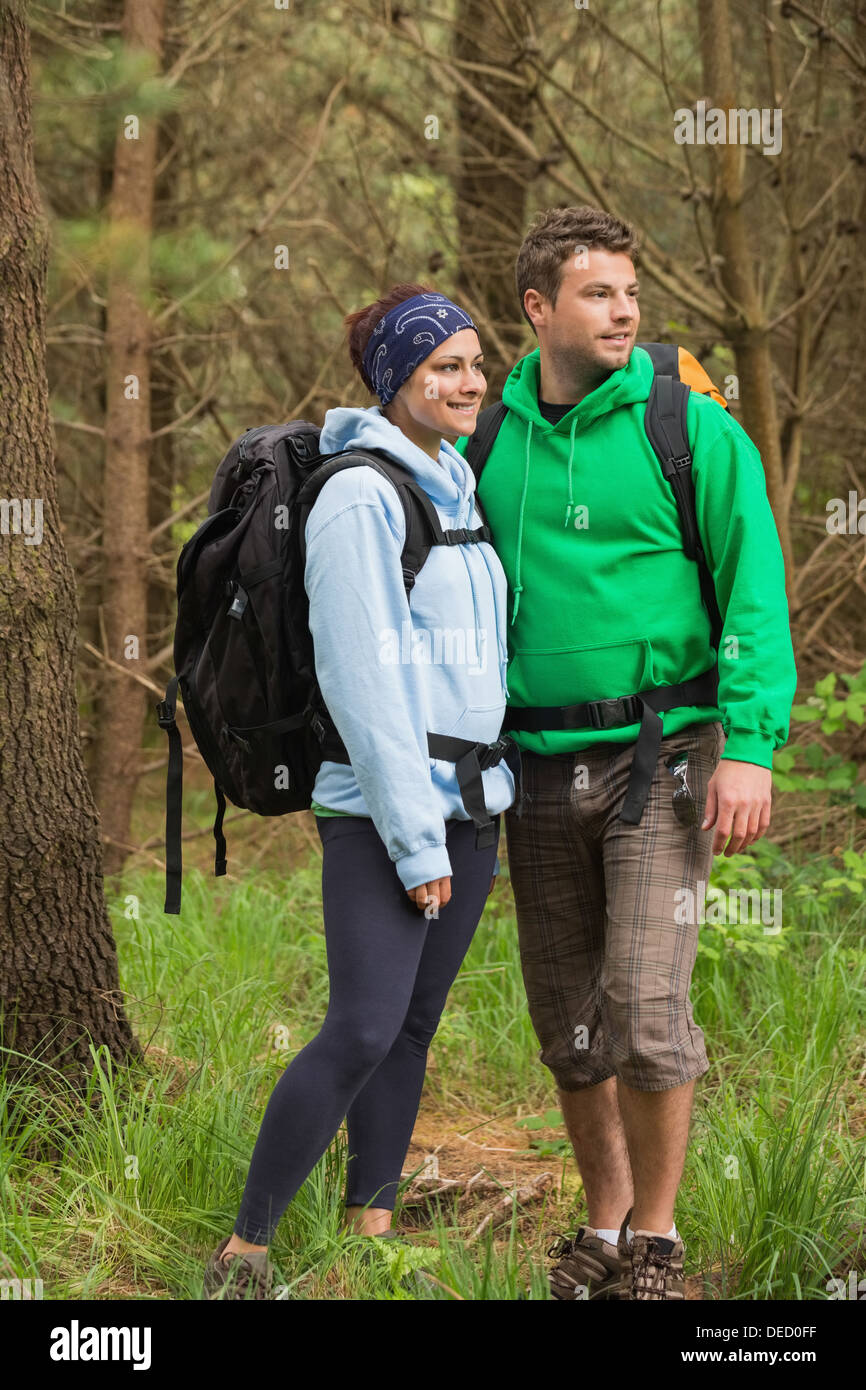 Smiling couple standing in a forest Stock Photo