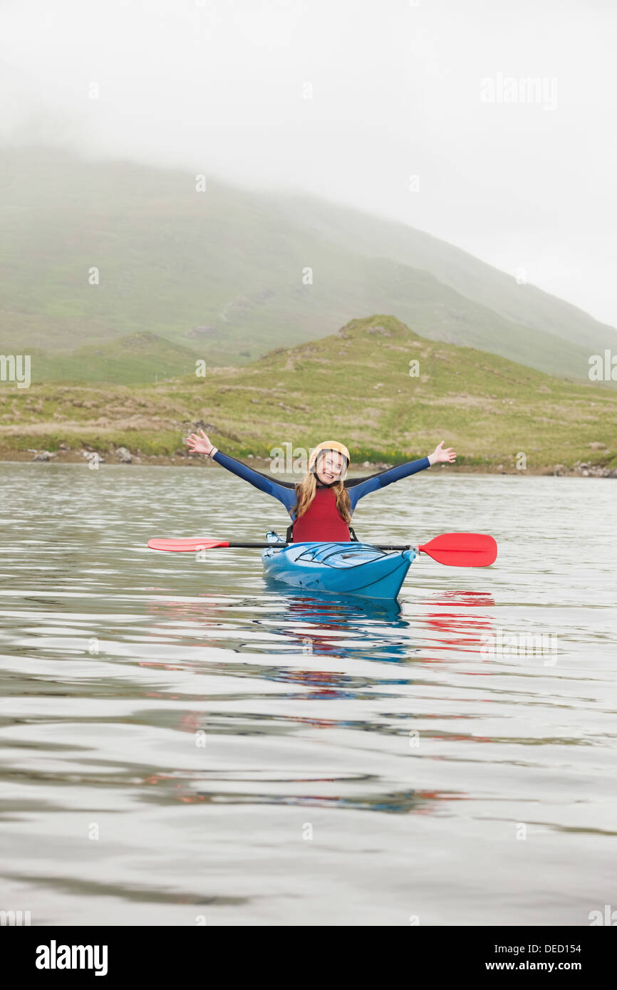 Blonde woman in a kayak Stock Photo