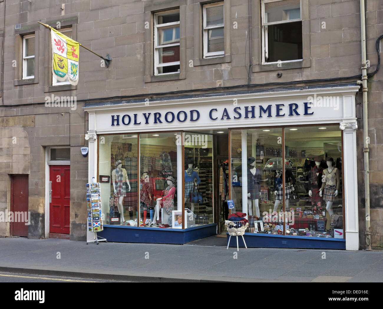 Holyrood cashmere shop, flying a flag of royal standards, Royal Mile, Edinburgh, Scotland, UK Stock Photo