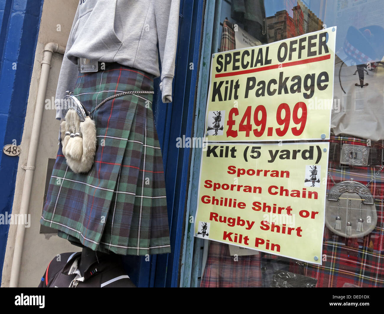 Edinburgh Kilt hire shop. Special tourist offer £49.99 Sporran, Chain, Ghillie Shirt Kilt Pin, Royal Mile Stock Photo